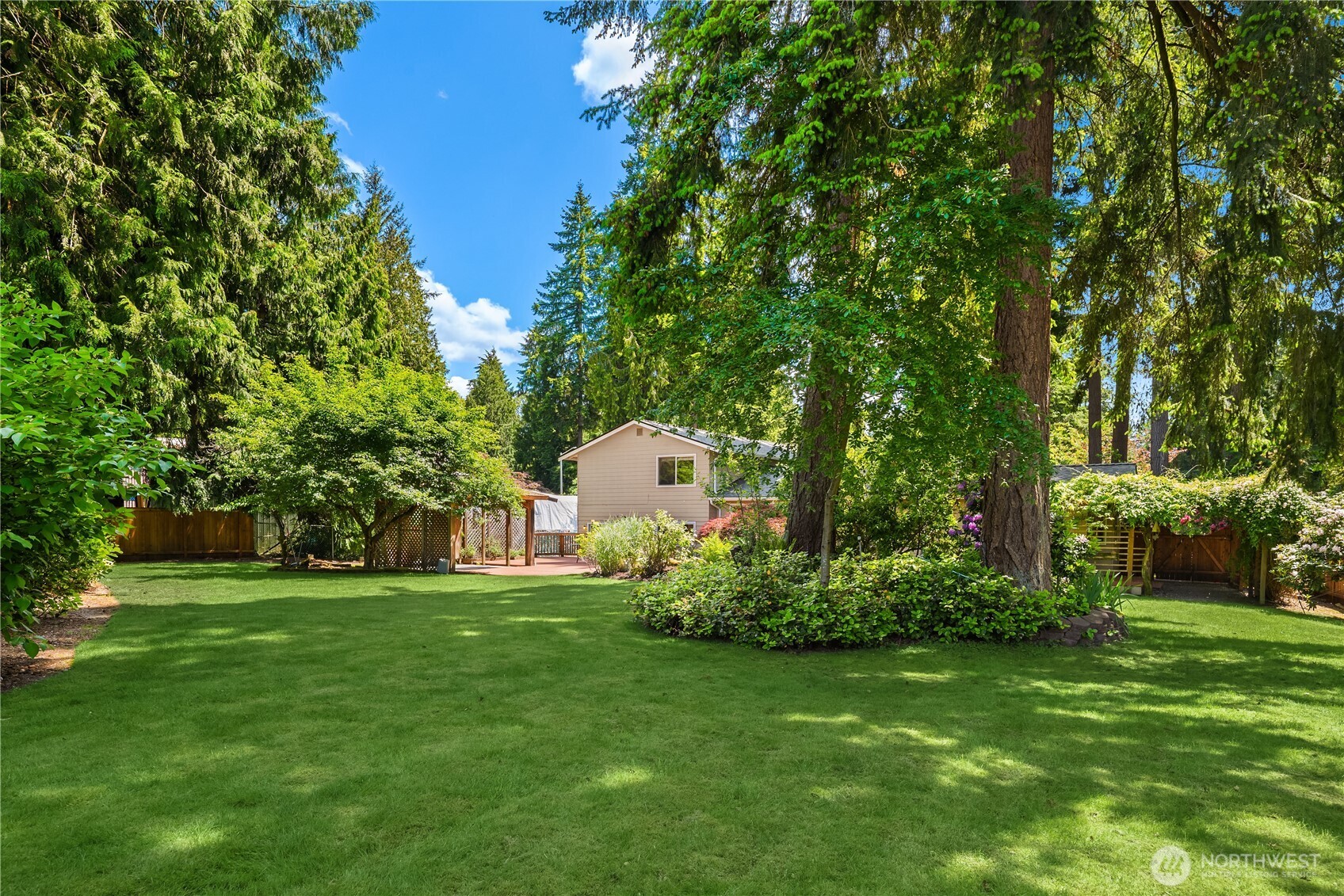 22809 38th Avenue Southeast Bothell, WA 98021 - Photo 31 of 40 a backyard of a house with a garden and plants