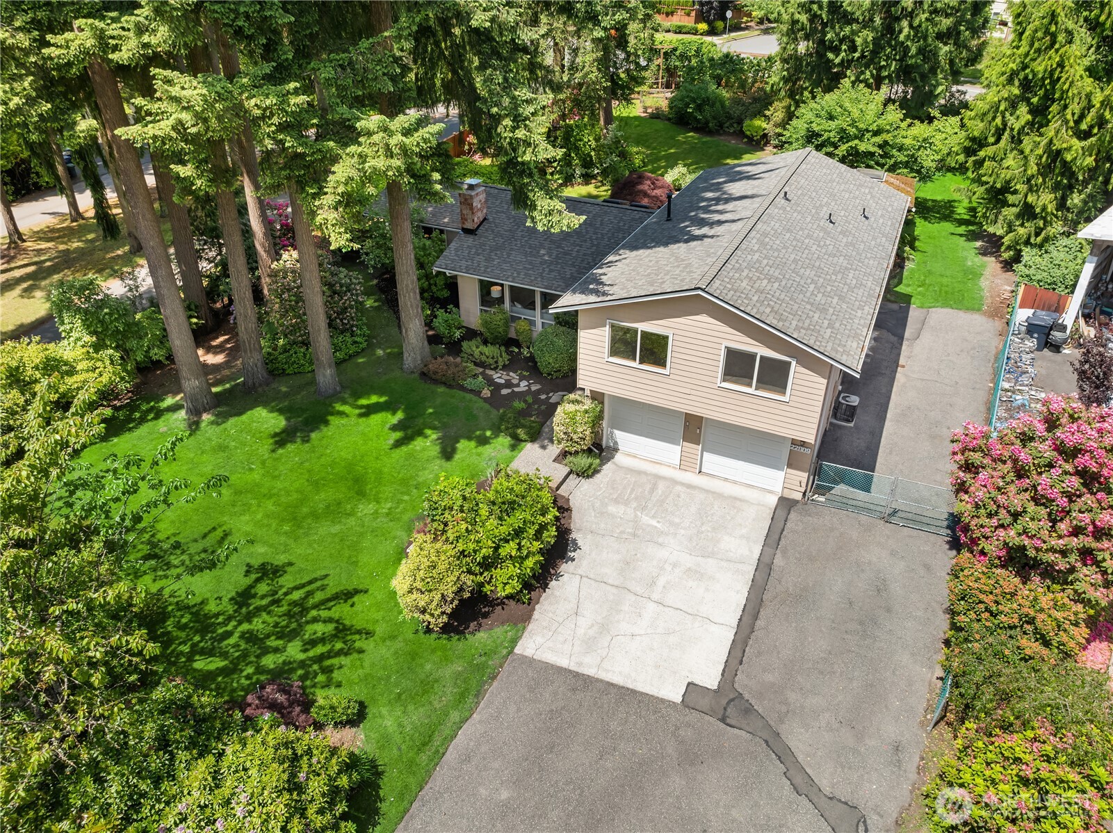 22809 38th Avenue Southeast Bothell, WA 98021 - Photo 34 of 40 an aerial view of a house with a yard and potted plants