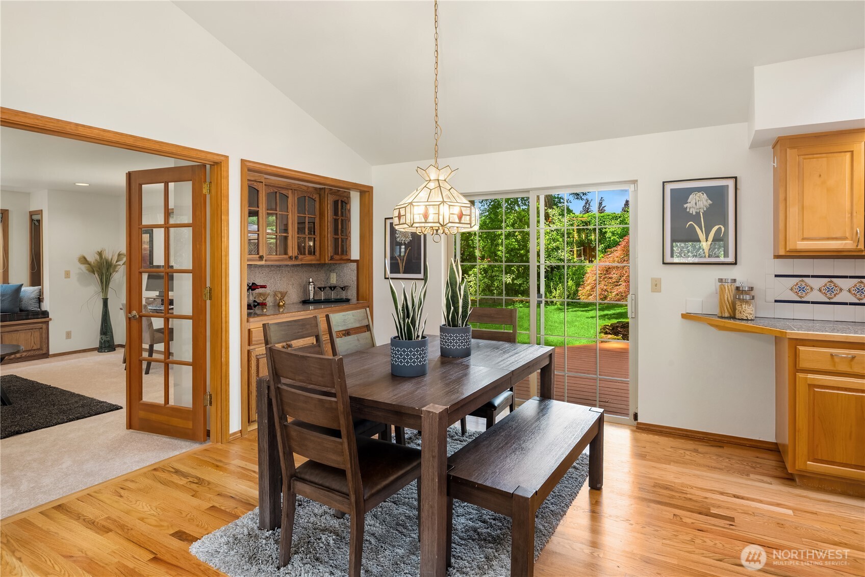 22809 38th Avenue Southeast Bothell, WA 98021 - Photo 9 of 40 a view of a dining room with furniture window and wooden floor