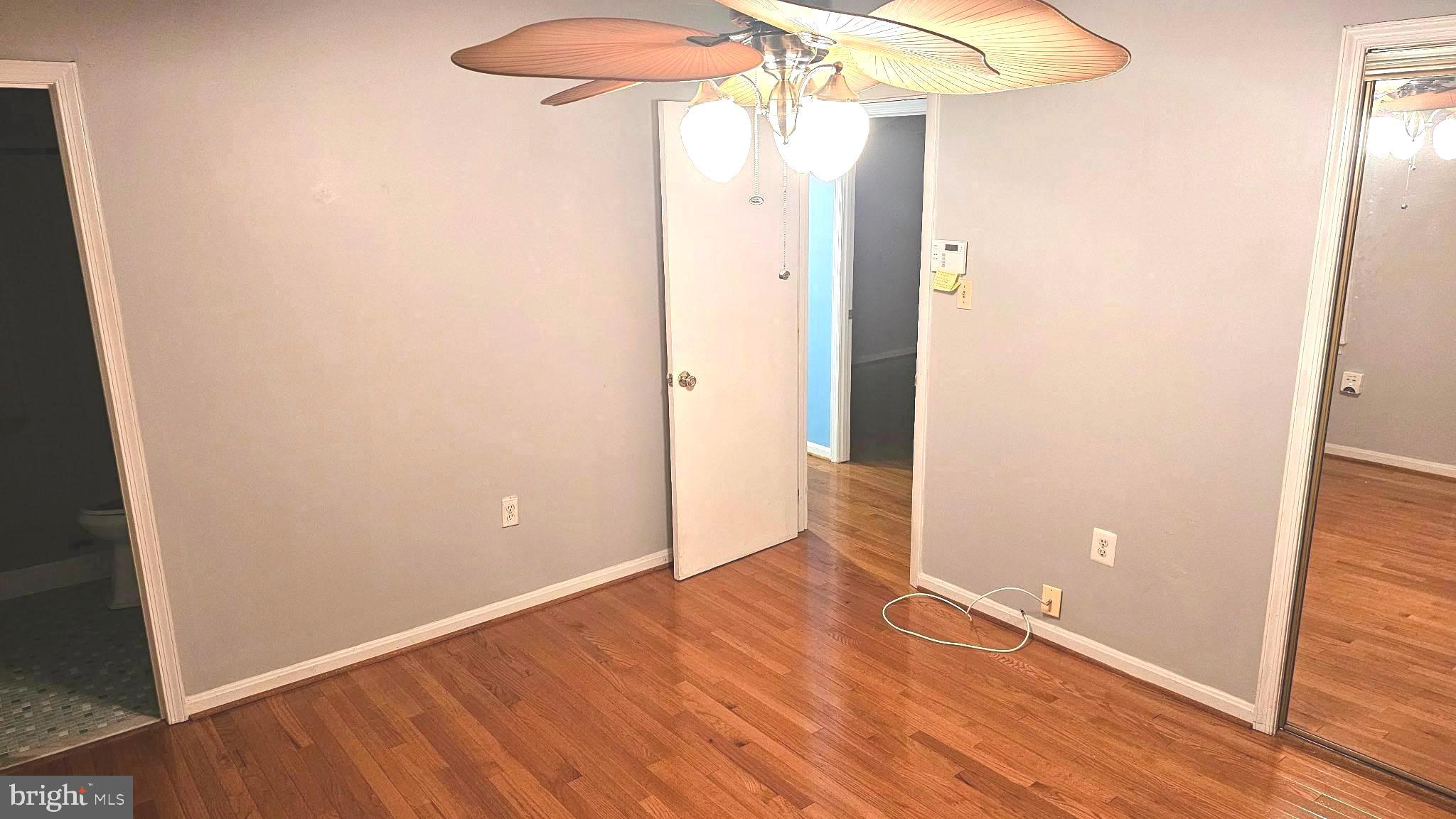 11603 Butlers Branch Road Clinton, MD 20735 - Photo 13 of 42 an empty room and wooden floor