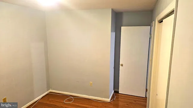 a view of a small space with wooden floor