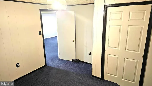 a view of a small space with wooden floor