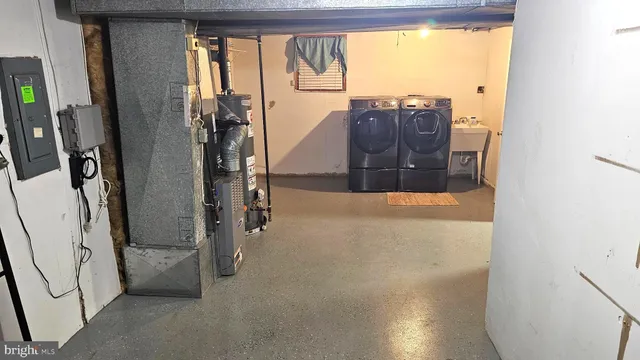 a view of a living room with furniture and a window