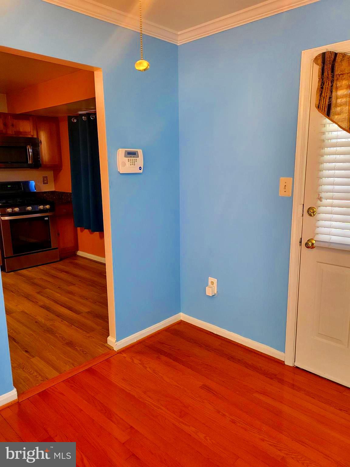 11603 Butlers Branch Road Clinton, MD 20735 - Photo 7 of 42 a view of empty room with wooden floor