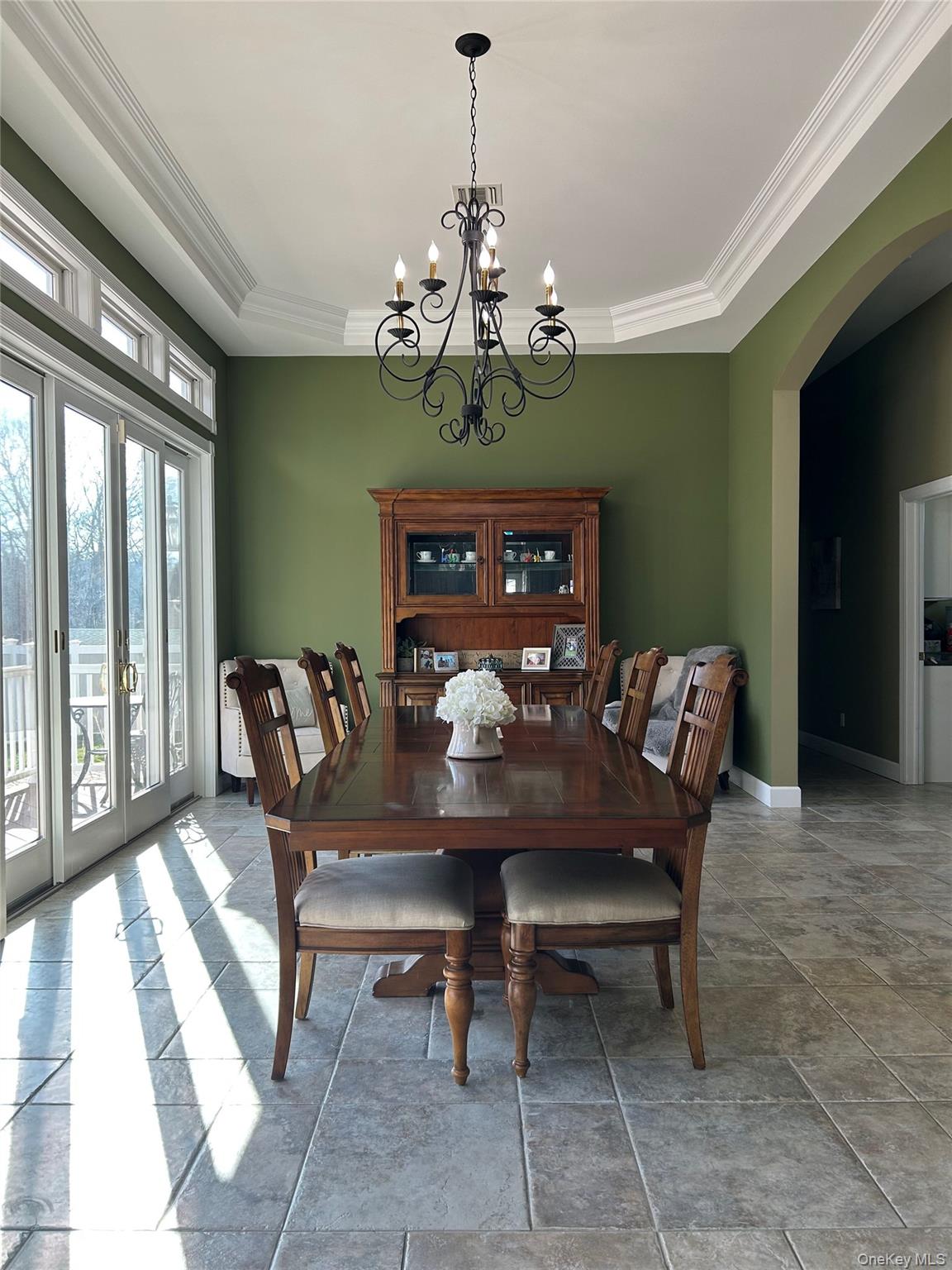 4 Vining Street Centereach, NY 11720 - Photo 11 of 26 a view of a dining room with furniture a chandelier and large windows