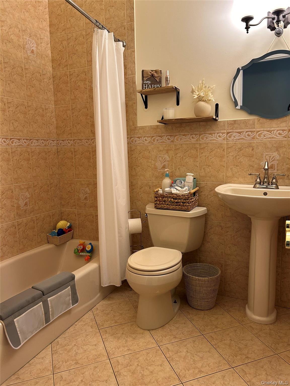 4 Vining Street Centereach, NY 11720 - Photo 14 of 26 a bathroom with a toilet sink and mirror