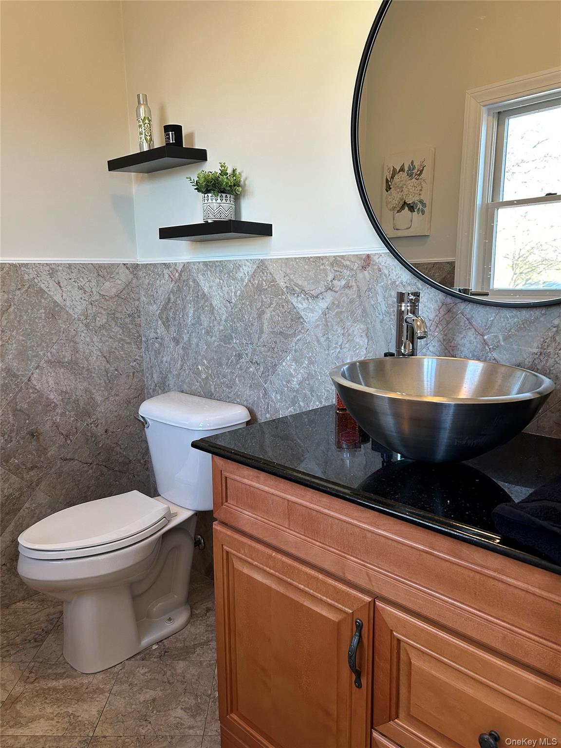 4 Vining Street Centereach, NY 11720 - Photo 2 of 26 a bathroom with a toilet and a sink
