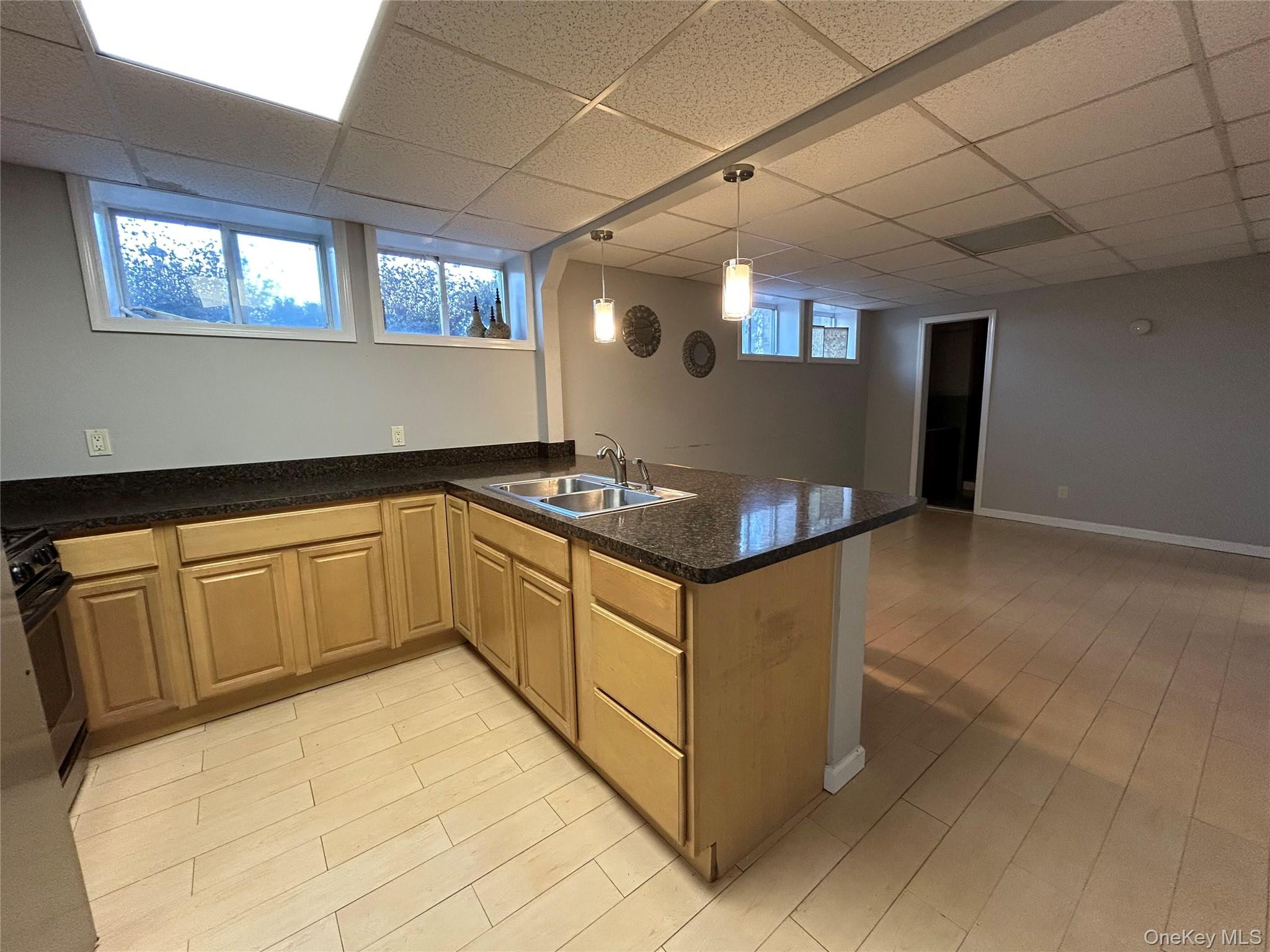 4 Vining Street Centereach, NY 11720 - Photo 23 of 26 a kitchen with stainless steel appliances granite countertop a stove a sink and a microwave