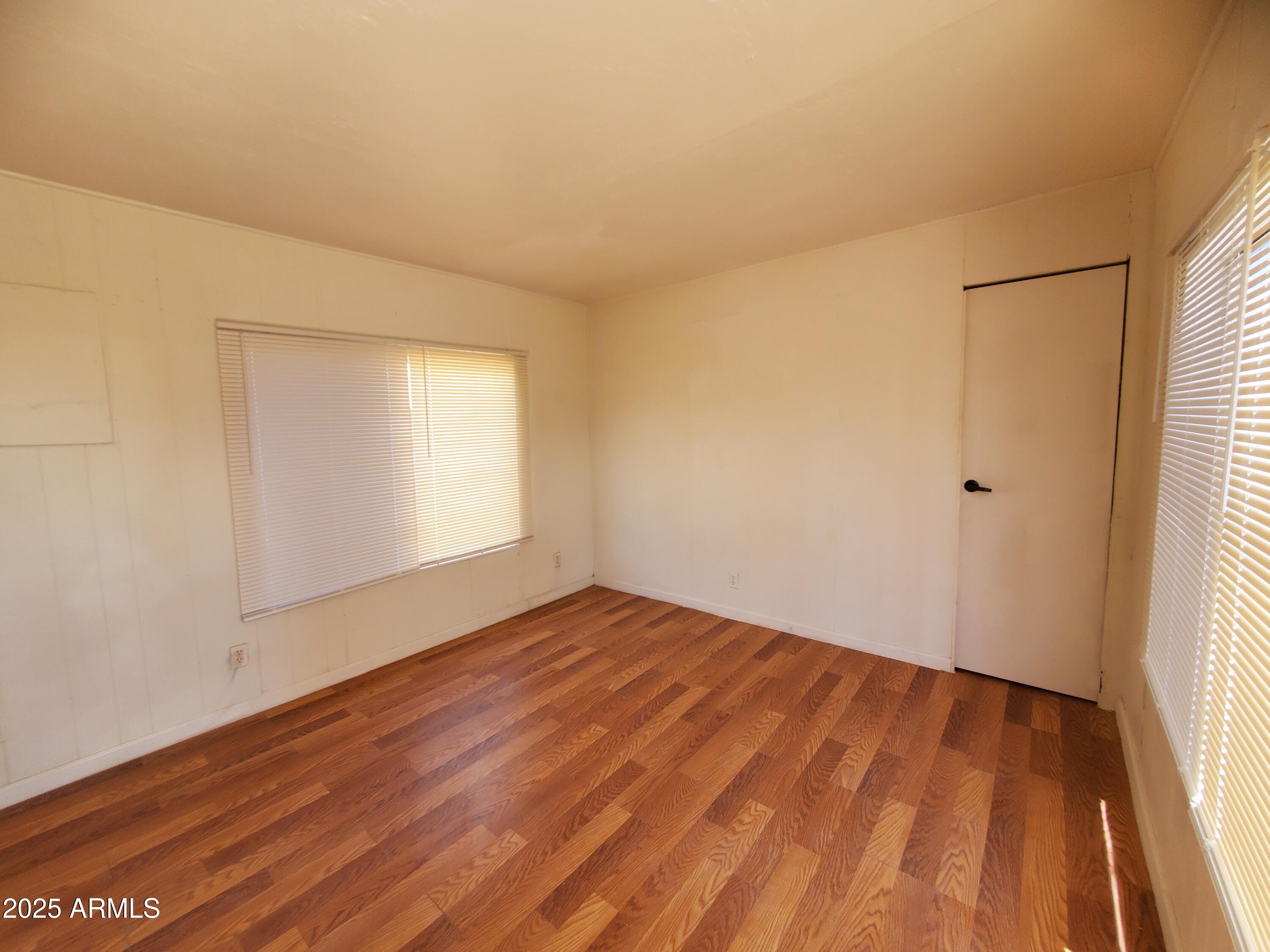 799 West Battaglia Road, Unit 22 Eloy, AZ 85131 - Photo 8 of 9 a view of empty room with wooden floor and fan