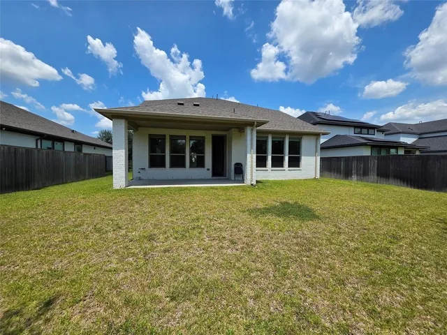 a view of a house with a small yard
