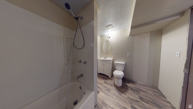 1348 Sagewood Road Price, UT 84501 - Photo 29 of 34 Full bath featuring vanity, shower / bath combination, wood finished floors, and a textured ceiling