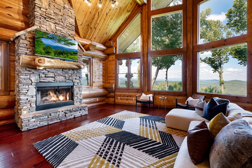 502 Overlook Drive Blue Ridge, GA 30513 - Photo 11 of 53 a living room with furniture a fireplace a large window and a fireplace
