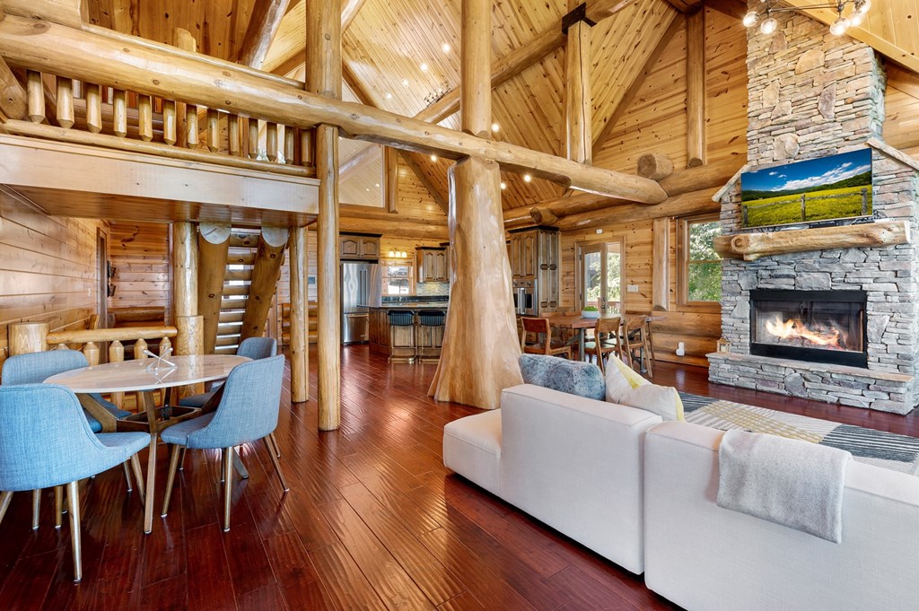 502 Overlook Drive Blue Ridge, GA 30513 - Photo 14 of 53 a living room with furniture a fireplace and a flat screen tv