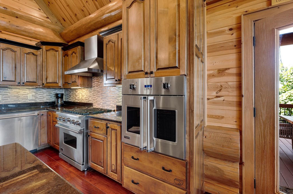 502 Overlook Drive Blue Ridge, GA 30513 - Photo 18 of 53 a kitchen with stainless steel appliances granite countertop a stove and a refrigerator