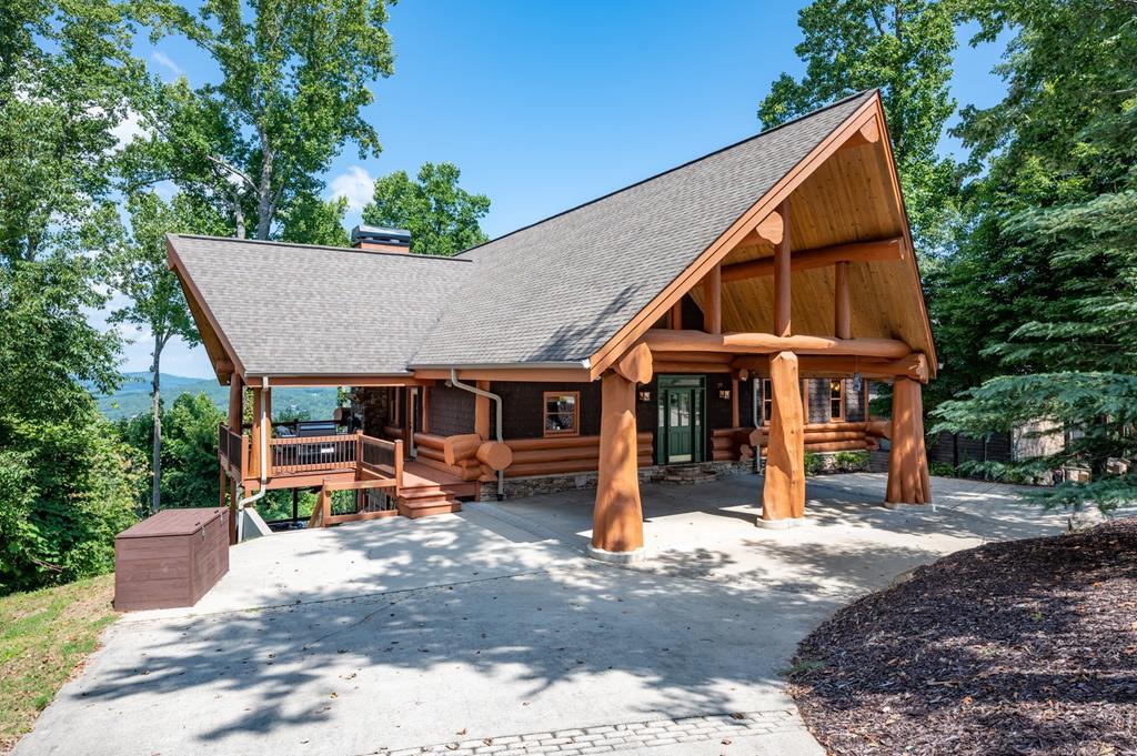 502 Overlook Drive Blue Ridge, GA 30513 - Photo 2 of 53 a view of a house with a patio and a yard