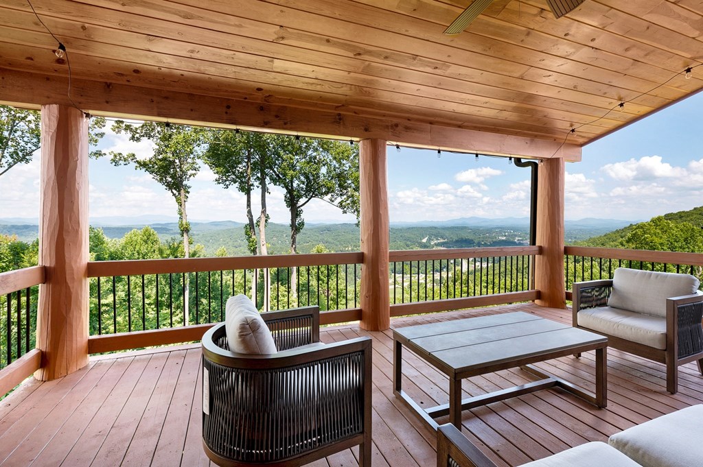 502 Overlook Drive Blue Ridge, GA 30513 - Photo 29 of 53 a view of a chair and tables in the balcony