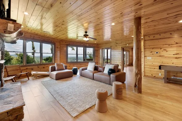 a sitting room with pool table and flat screen tv