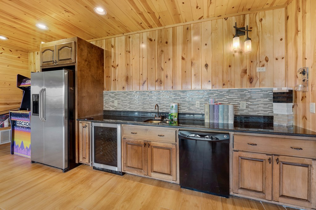 502 Overlook Drive Blue Ridge, GA 30513 - Photo 48 of 53 a kitchen with stainless steel appliances granite countertop a refrigerator a stove and a sink