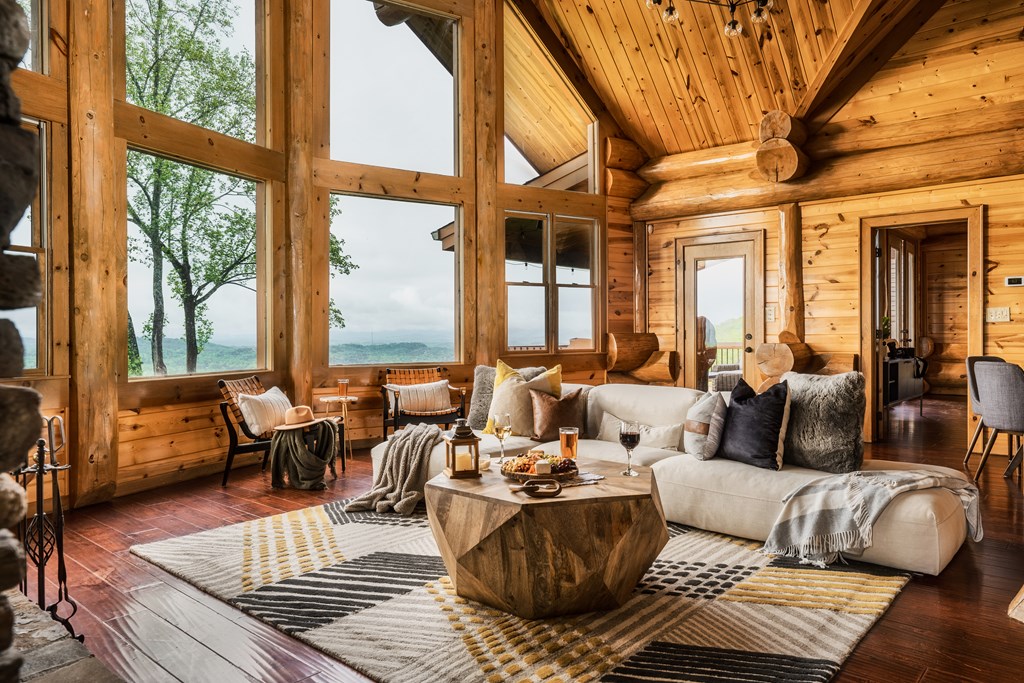 502 Overlook Drive Blue Ridge, GA 30513 - Photo 9 of 53 a living room with furniture and large windows