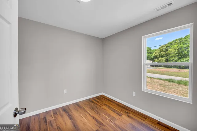 a view of an empty room and window
