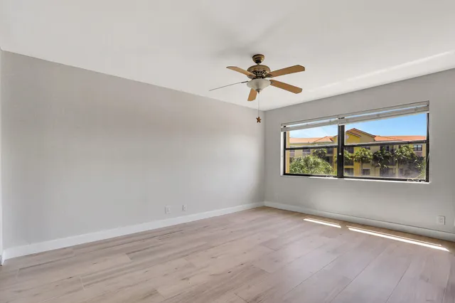 a view of room with wooden floor and window