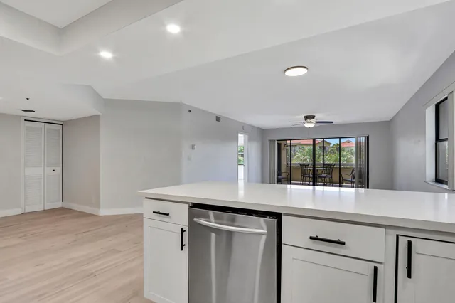 a kitchen with a sink and window