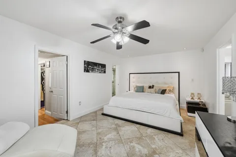 a bedroom with a bed and a couch