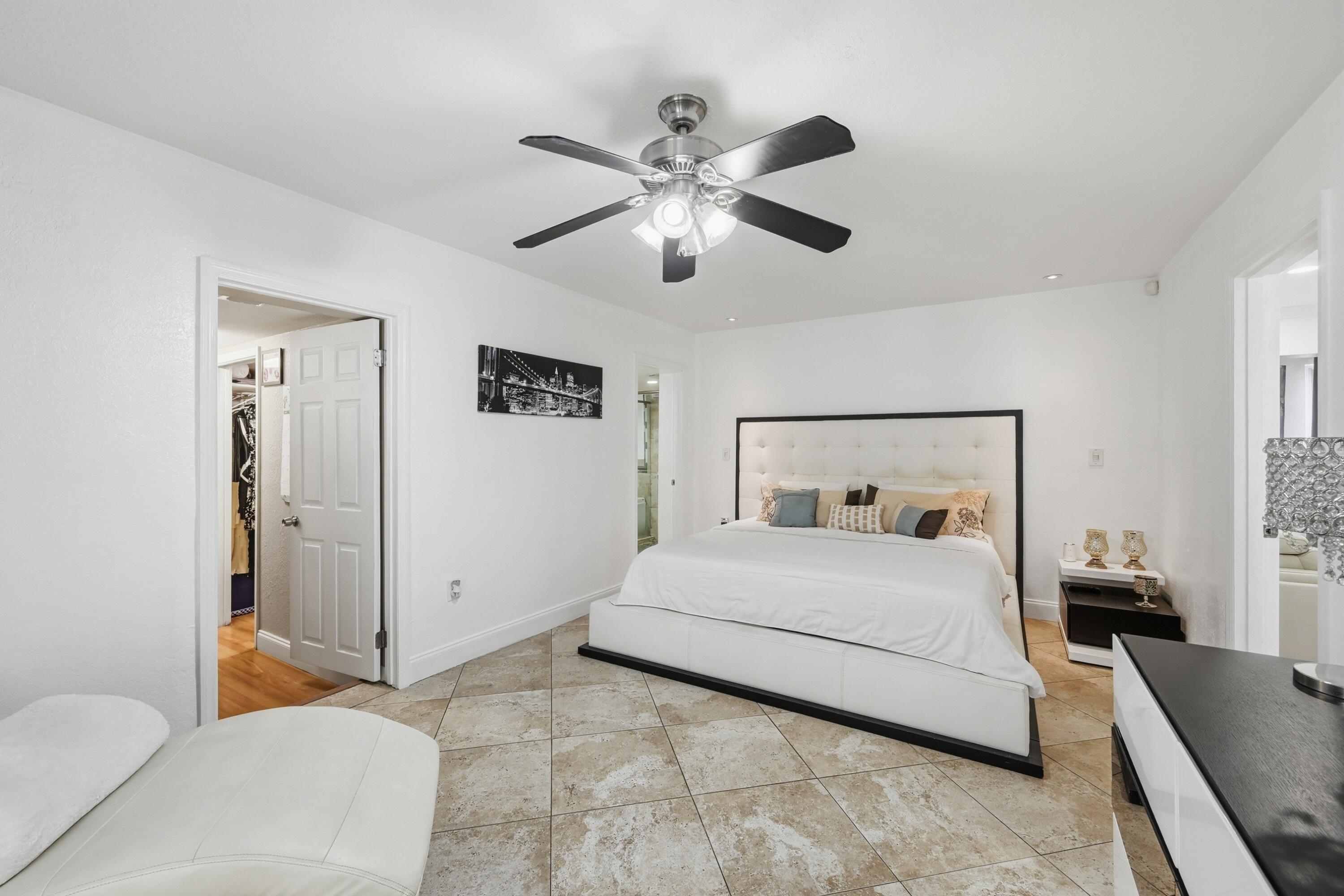 6271 Harding Street Hollywood, FL 33024 - Photo 12 of 58 a bedroom with a bed and a couch