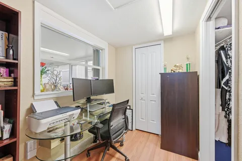 a view of a dining room with furniture and wooden floor