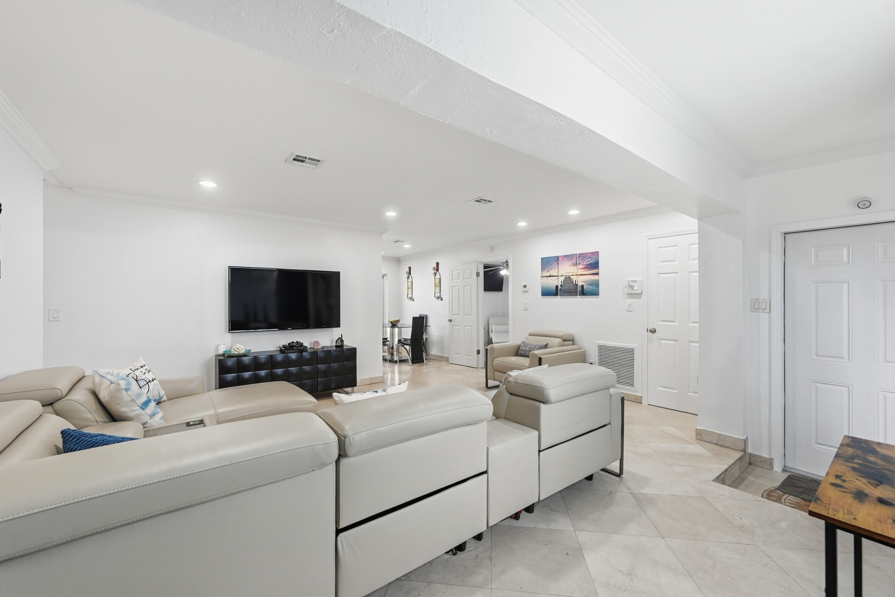 6271 Harding Street Hollywood, FL 33024 - Photo 2 of 58 a room with furniture a flat screen tv and a couch