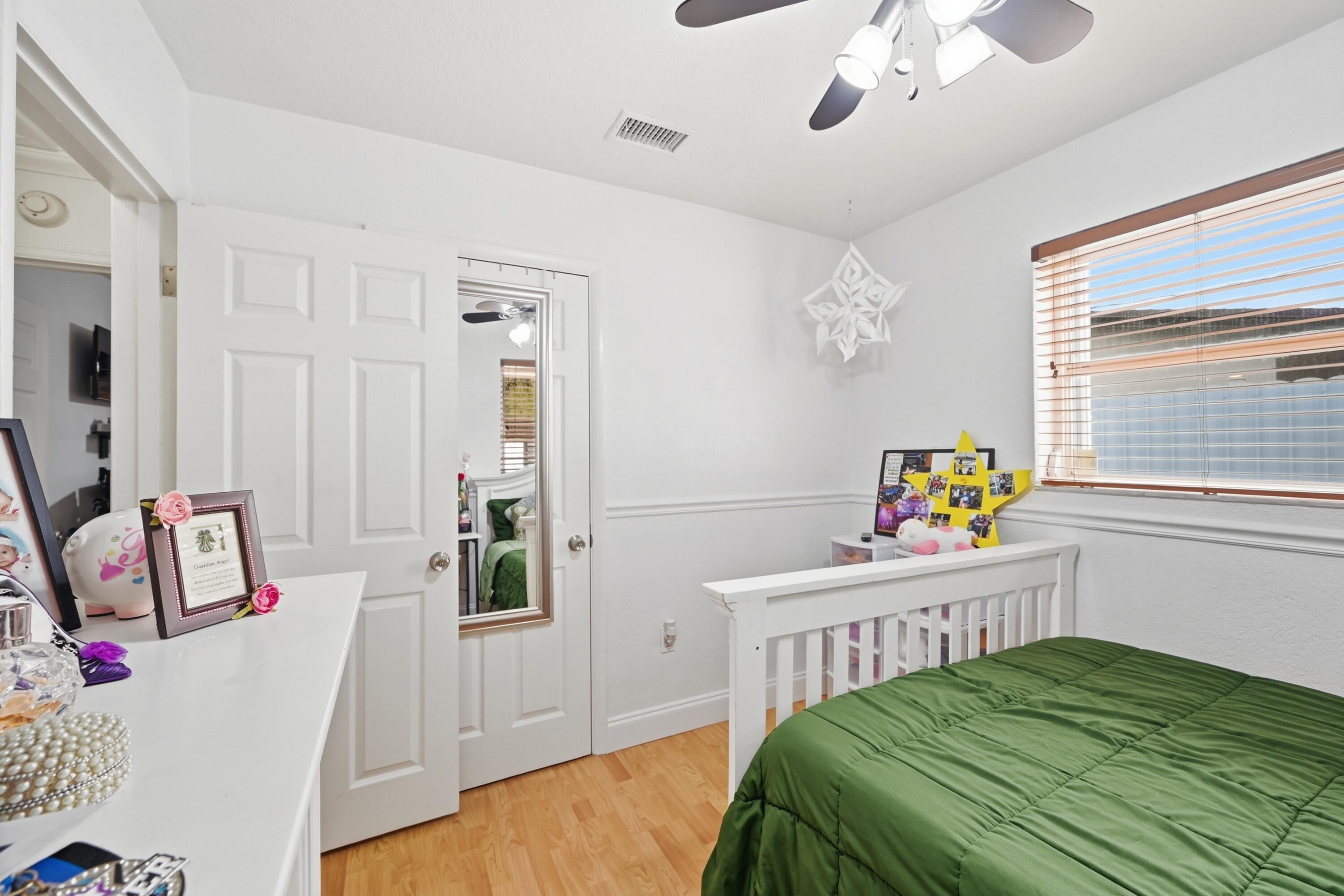 6271 Harding Street Hollywood, FL 33024 - Photo 24 of 58 a bedroom with a bed and a window