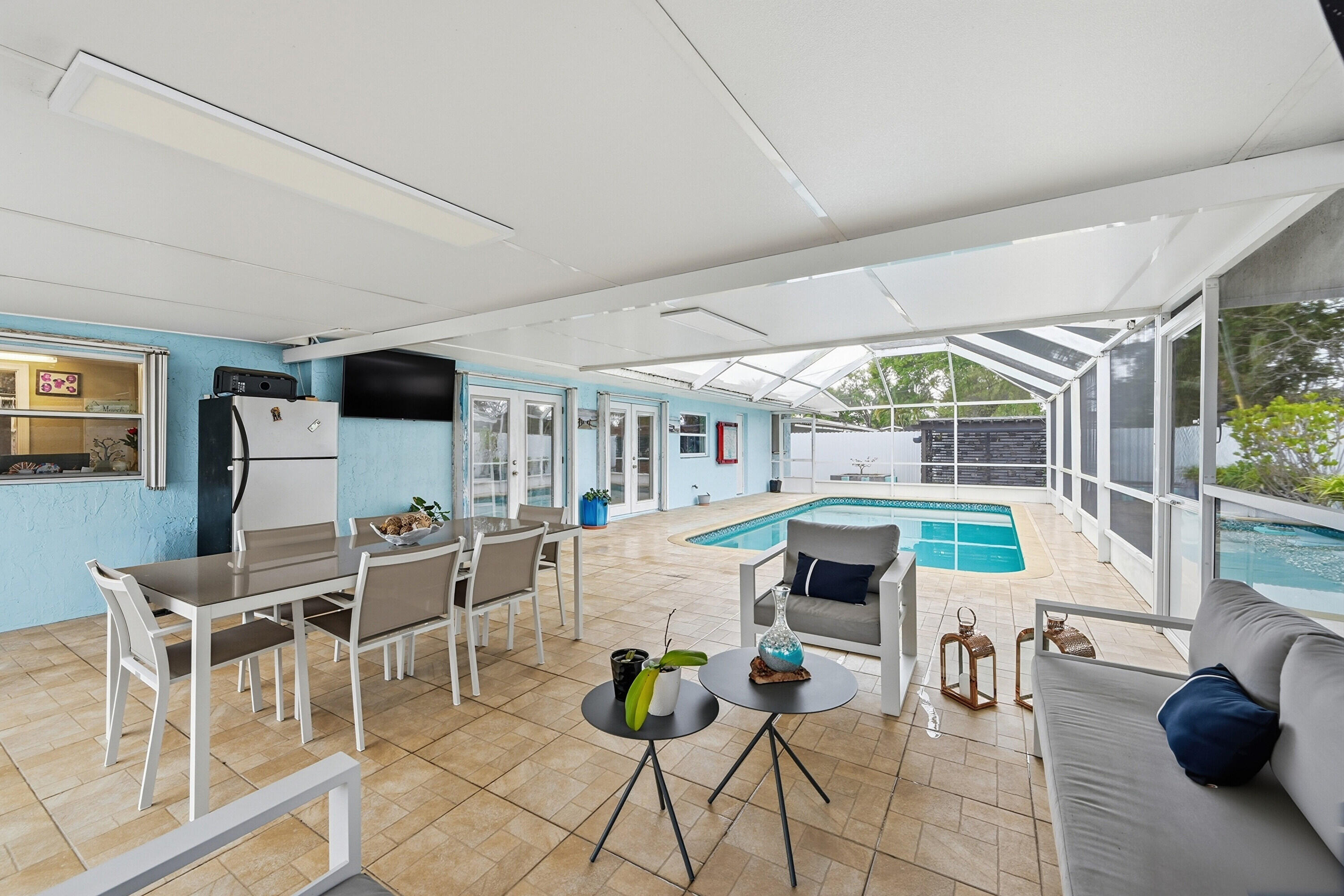 6271 Harding Street Hollywood, FL 33024 - Photo 27 of 58 a view of a dining room with furniture one side kitchen view and wooden floor