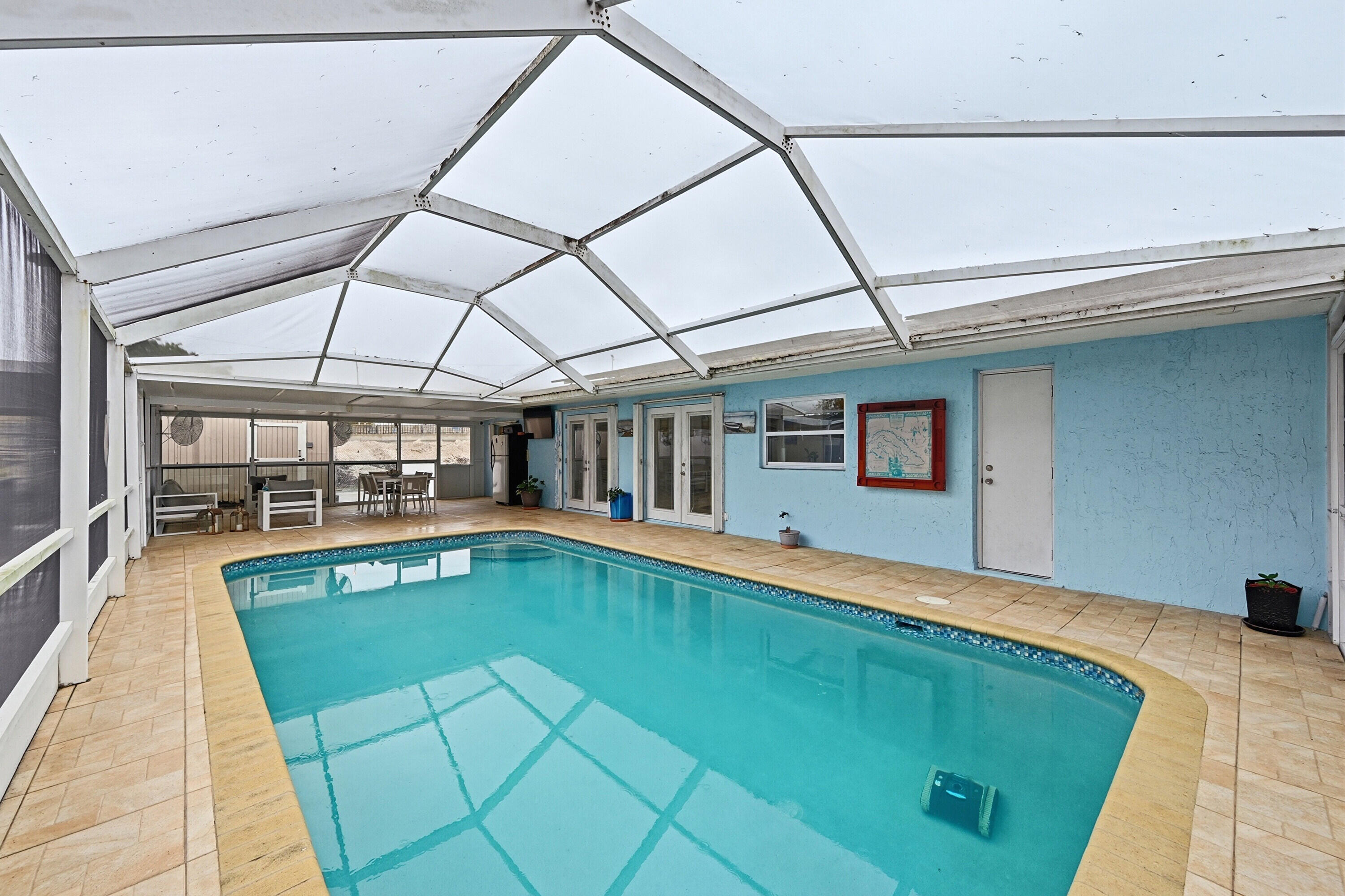 6271 Harding Street Hollywood, FL 33024 - Photo 28 of 58 a swimming pool with outdoor seating