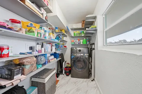 an aerial view of a house with a yard basket ball court and outdoor seating