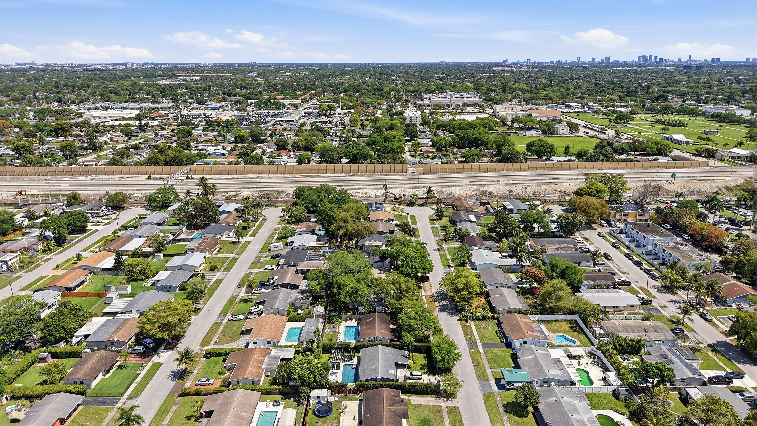 6271 Harding Street Hollywood, FL 33024 - Photo 43 of 58 an aerial view of residential building with parking and yard