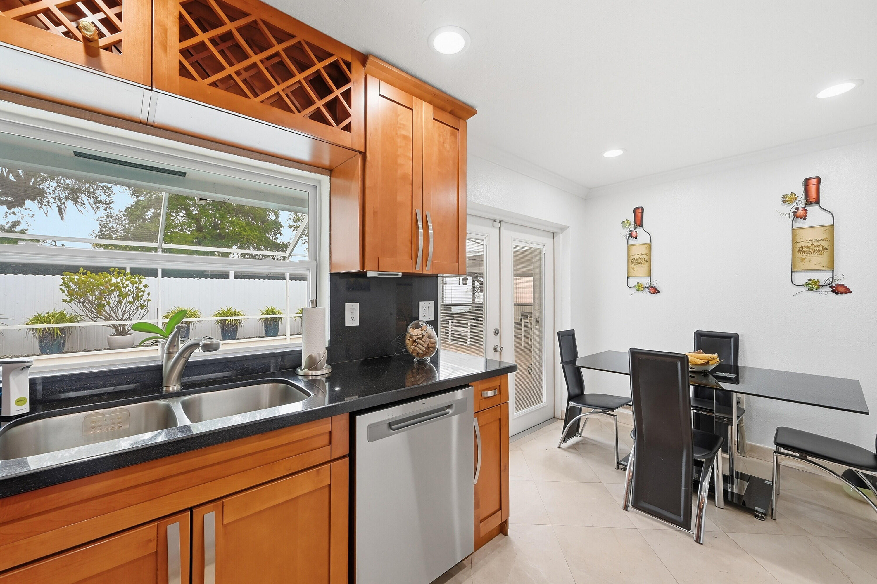 6271 Harding Street Hollywood, FL 33024 - Photo 9 of 58 a kitchen with stainless steel appliances granite countertop a sink and a cabinets