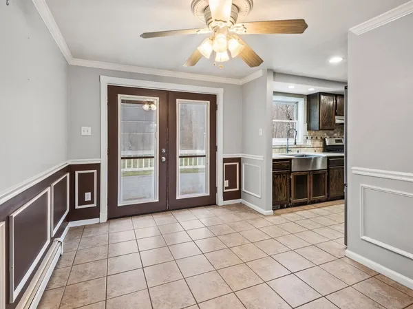 a large kitchen with cabinets and stainless steel appliances
