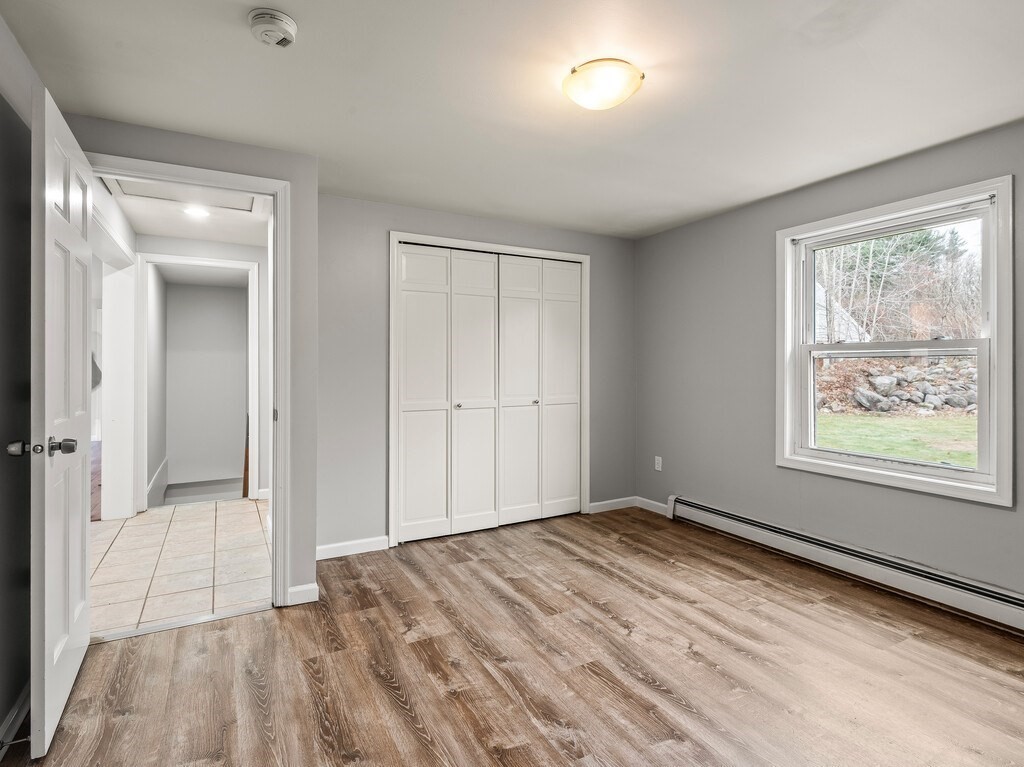 281 Brooks Station Road, Unit 1 Princeton, MA 01541 - Photo 15 of 36 wooden floor in an empty room