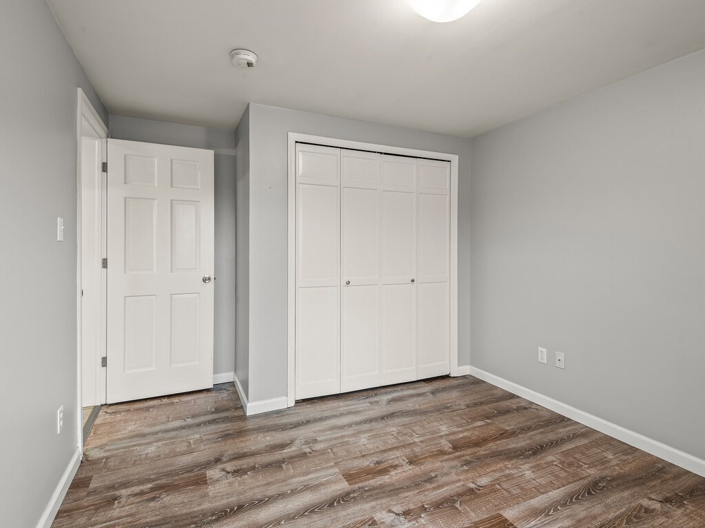 281 Brooks Station Road, Unit 1 Princeton, MA 01541 - Photo 17 of 36 a view of an empty room with wooden floor