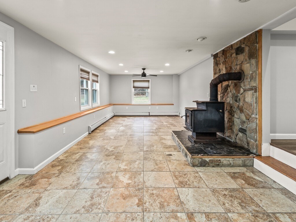281 Brooks Station Road, Unit 1 Princeton, MA 01541 - Photo 21 of 36 a view of an empty room and fire place