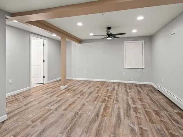 a view of an empty room with a window