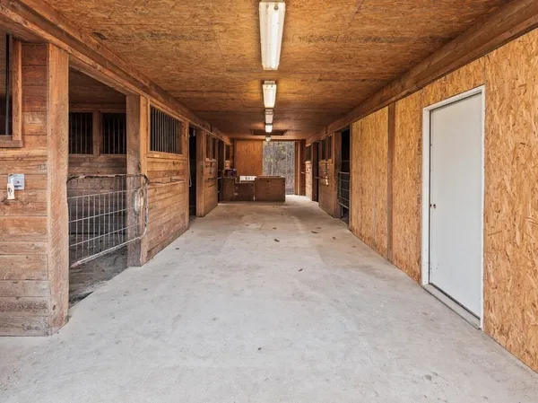 a view of empty room with floor to ceiling window