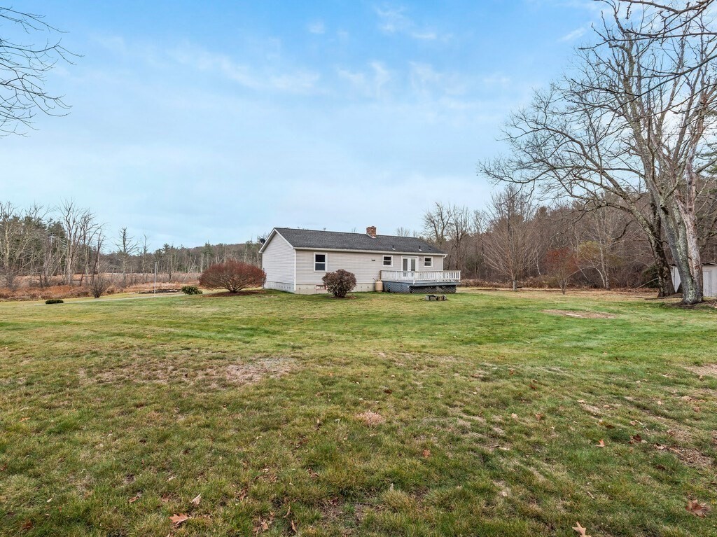 281 Brooks Station Road, Unit 1 Princeton, MA 01541 - Photo 35 of 36 a view of a house with a yard