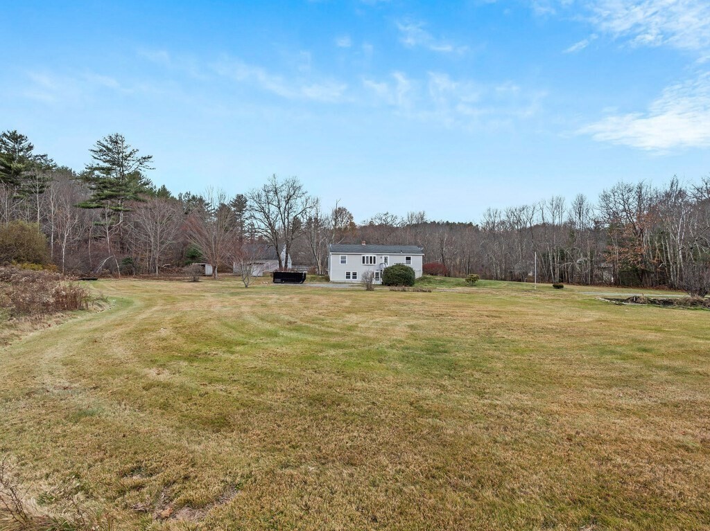 281 Brooks Station Road, Unit 1 Princeton, MA 01541 - Photo 36 of 36 a view of a field with trees in the background