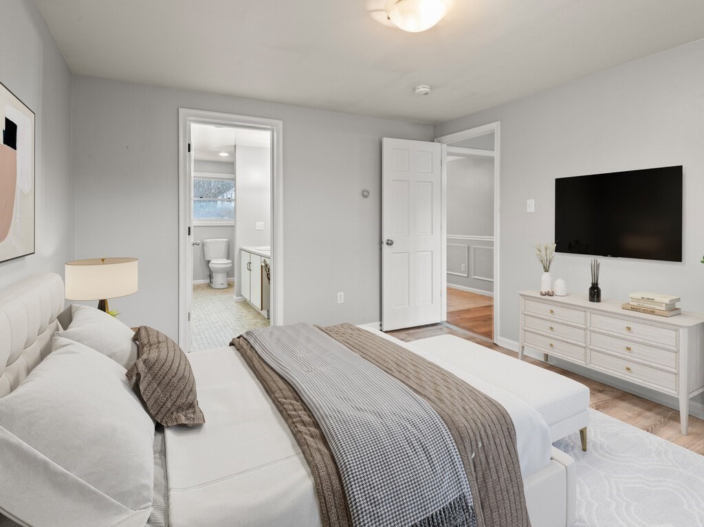 281 Brooks Station Road, Unit 1 Princeton, MA 01541 - Photo 6 of 36 a bedroom with a bed and a flat screen tv