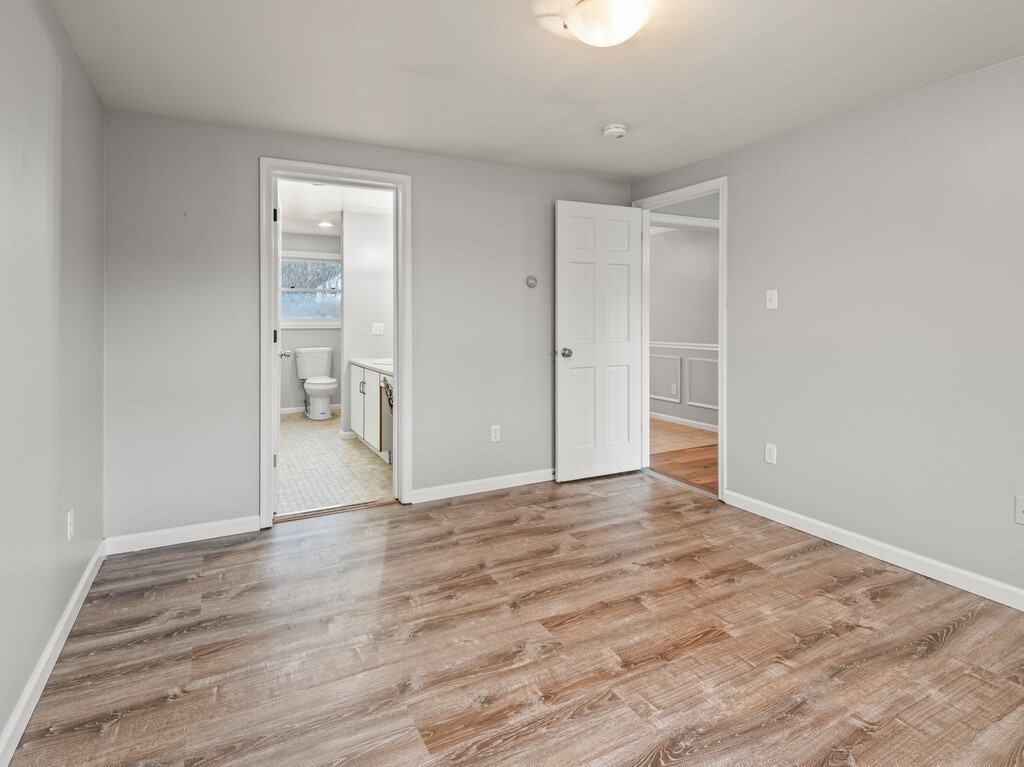 281 Brooks Station Road, Unit 1 Princeton, MA 01541 - Photo 7 of 36 a view of an empty room and wooden floor