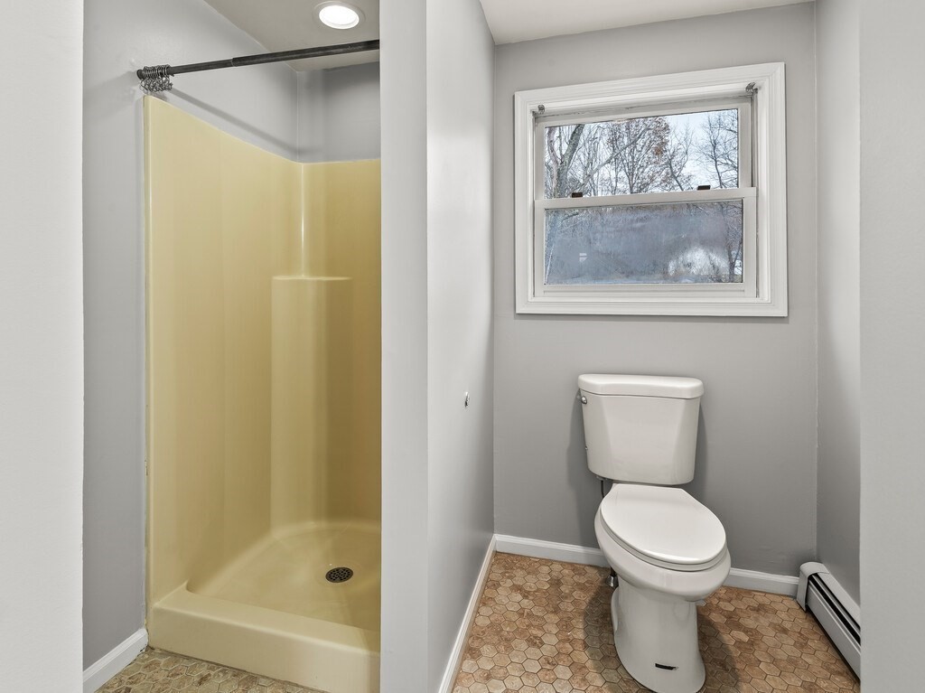 281 Brooks Station Road, Unit 1 Princeton, MA 01541 - Photo 9 of 36 a bathroom with a toilet and a shower