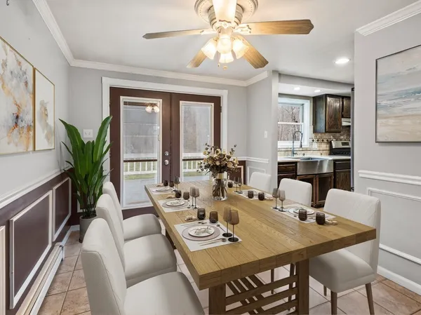 a view of a dining room with furniture window and wooden floor