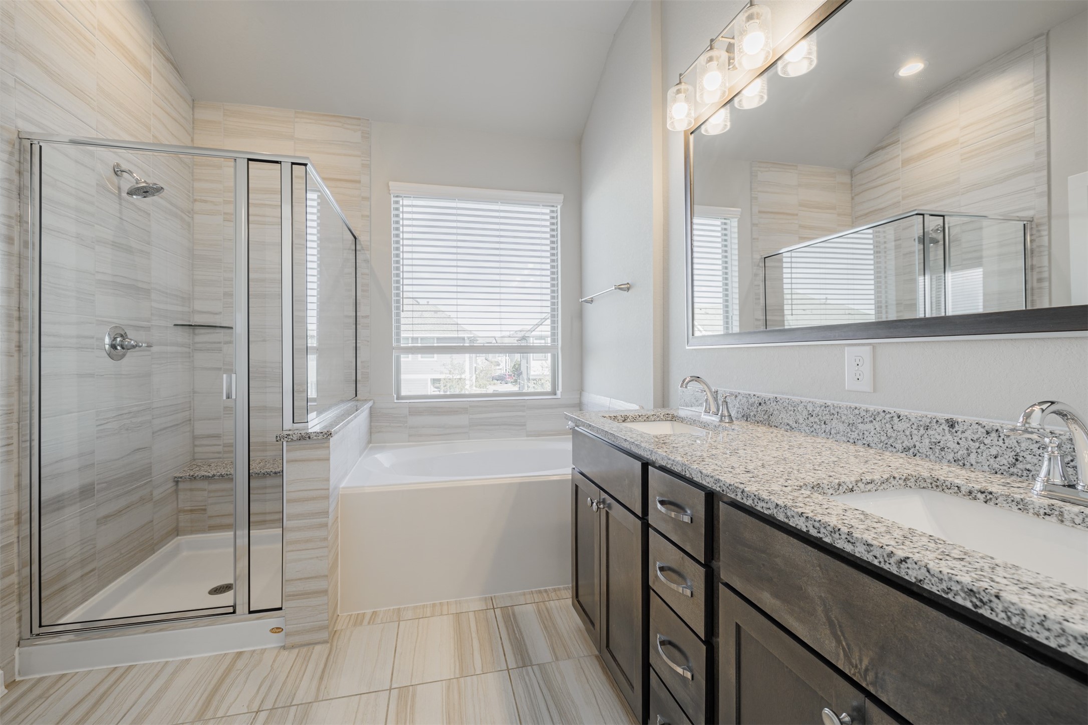 19622 Talley Valley Drive Cypress, TX 77433 - Photo 10 of 18 a bathroom with a granite countertop sink mirror and shower