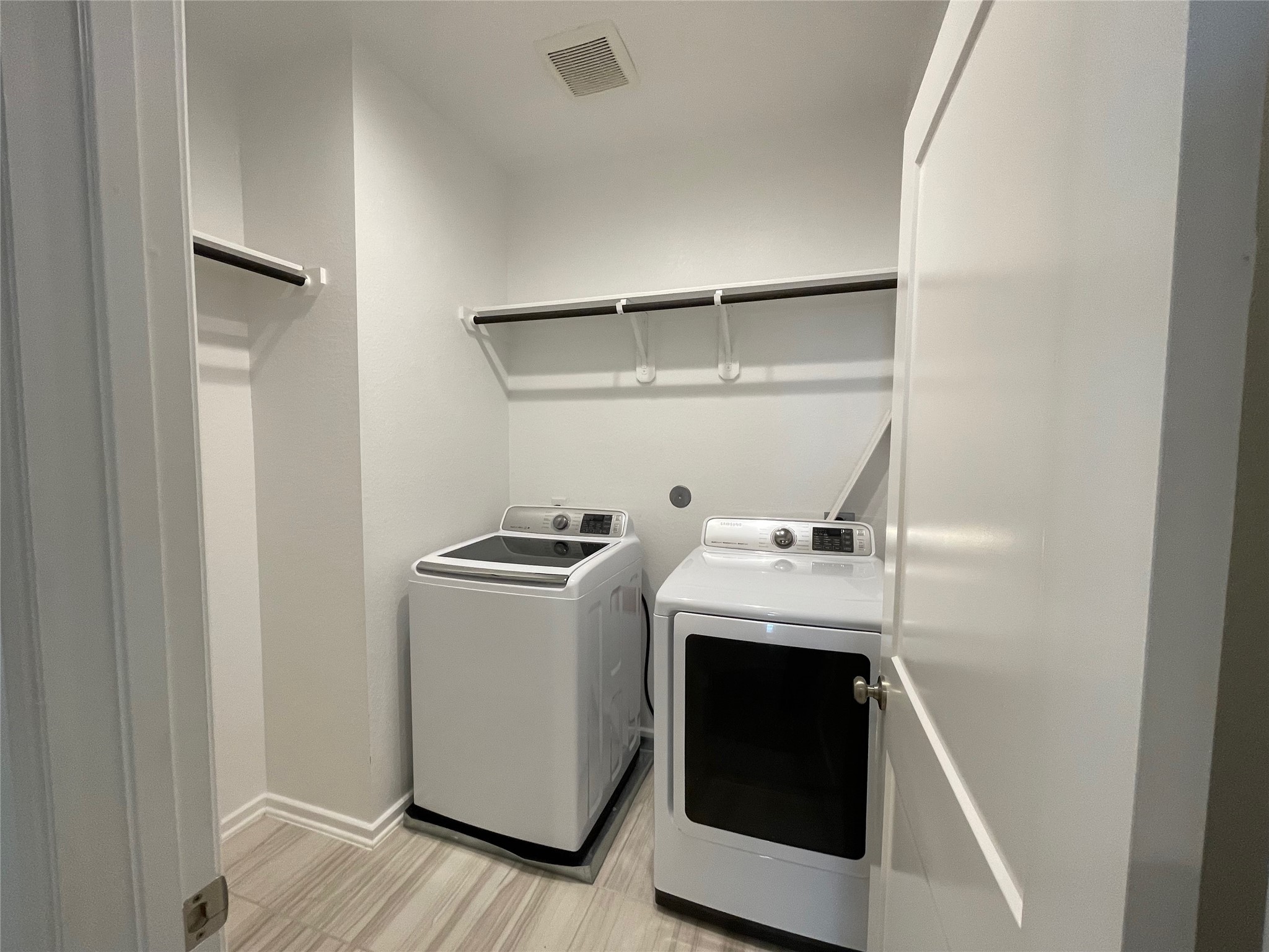 19622 Talley Valley Drive Cypress, TX 77433 - Photo 11 of 18 a utility room with dryer and washer